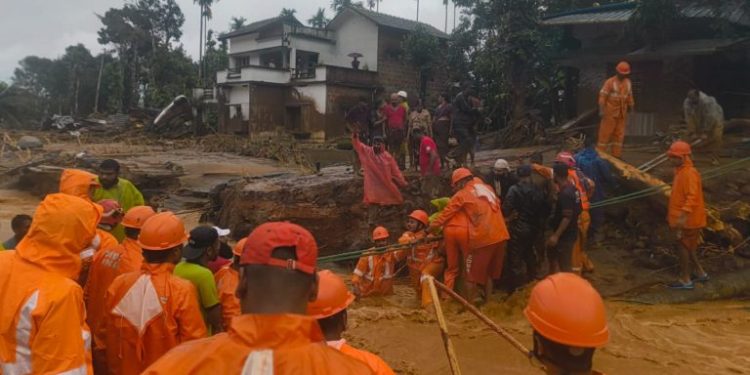 National Disaster Response Force (NDRF) personnel conduct rescue operation after huge landslides in the hilly areas near Meppadi, in Wayanad district, Kerala