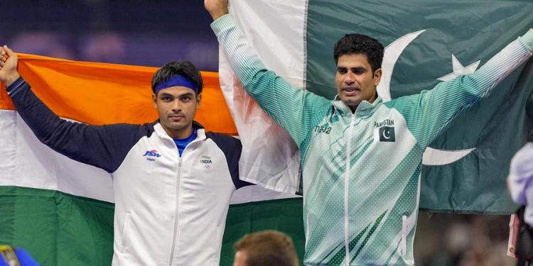 Silver medallist India's Neeraj Chopra and Gold medallist Pakistan's Arshad Nadeem celebrate after the men's javelin throw final at the 2024 Summer Olympics, in Paris, France.