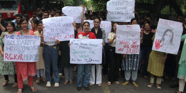 Junior doctors during a peaceful protest march in Jammu on Monday.