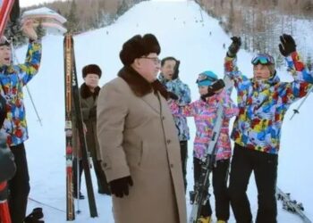 This undated photo released by KCNA on November 28, 2016 shows North Korean leader Kim Jong-un (center) standing among skiers at Samjiyun