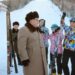 This undated photo released by KCNA on November 28, 2016 shows North Korean leader Kim Jong-un (center) standing among skiers at Samjiyun