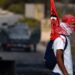 A Palestinian youth carries a flag of the Popular Front for the Liberation of Palestine (PLFP) in Ramallah, in the occupied West Bank. AFP