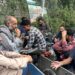 Kashmiri migrants without work idle at the Solan bus stand