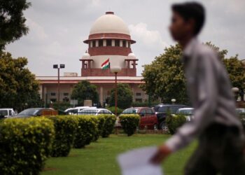 A man walks inside the premises of the Supreme Court in New Delhi.