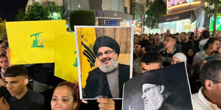 Representative Image: Palestinian protesters carry Hezbollah flags and posters with a picture of Hezbollah leader Sayyed Hassan Nasrallah during a rally in support of Hezbollah, in the West Bank city of Ramallah