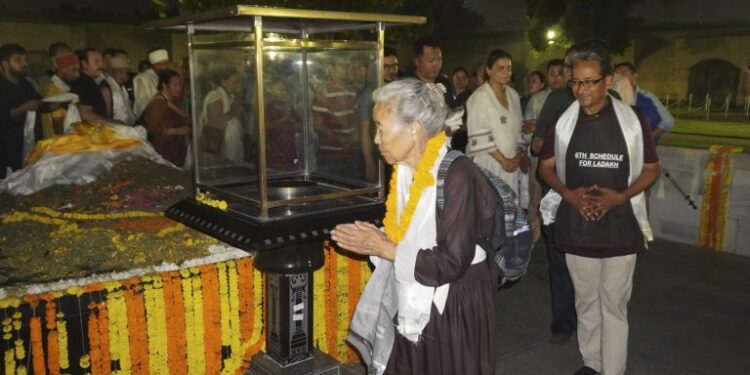 Climate activist Sonam Wangchuk and other Ladakhis pay tribute to Mahatma Gandhi on his birth anniversary, after being brought to Rajghat, in New Delhi.