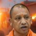 Adityanath. In the background is an image circulating, purportedly of Bahraich during the communal violence there.