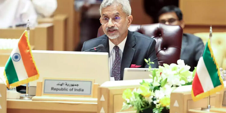 India's Minister for External Affairs Subrahmanyam Jaishankar, second left, walks with a Pakistani official Ilyas Nizami, center, upon his arrival at an airbase in Rawalpindi, Pakistan.