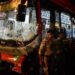 Security personnel near the damaged Brihanmumbai Electric Supply and Transport (BEST) undertaking's bus after it rammed into pedestrians as well as vehicles on a road at Kurla, in Mumbai, Monday.