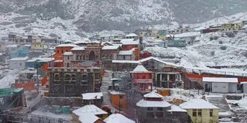 Chamoli: Badrinath Dham receives the first snowfall of the season, in Chamoli district on Monday