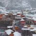 Chamoli: Badrinath Dham receives the first snowfall of the season, in Chamoli district on Monday