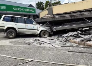 A damaged car trapped underneath a collapsed building in Vanuatu's capital Port Vila after a 7.3-magnitude quake struck on December 17 at a depth of 57 kilometres.