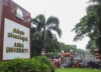 Police personnel stand guard at the entrance of Anna University after the alleged sexual assault on a girl student.