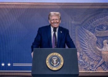 US President Donald Trump is seen on a large screen during his address by video conference at the World Economic Forum (WEF) annual meeting in Davos.(AFP)