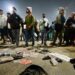 Pilgrims look for their belongings at the site of a stampede amid the ongoing Maha Kumbh Mela festival in Prayagraj.